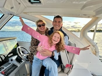 The Miller's pose on their Pursuit OS 355 Sport.