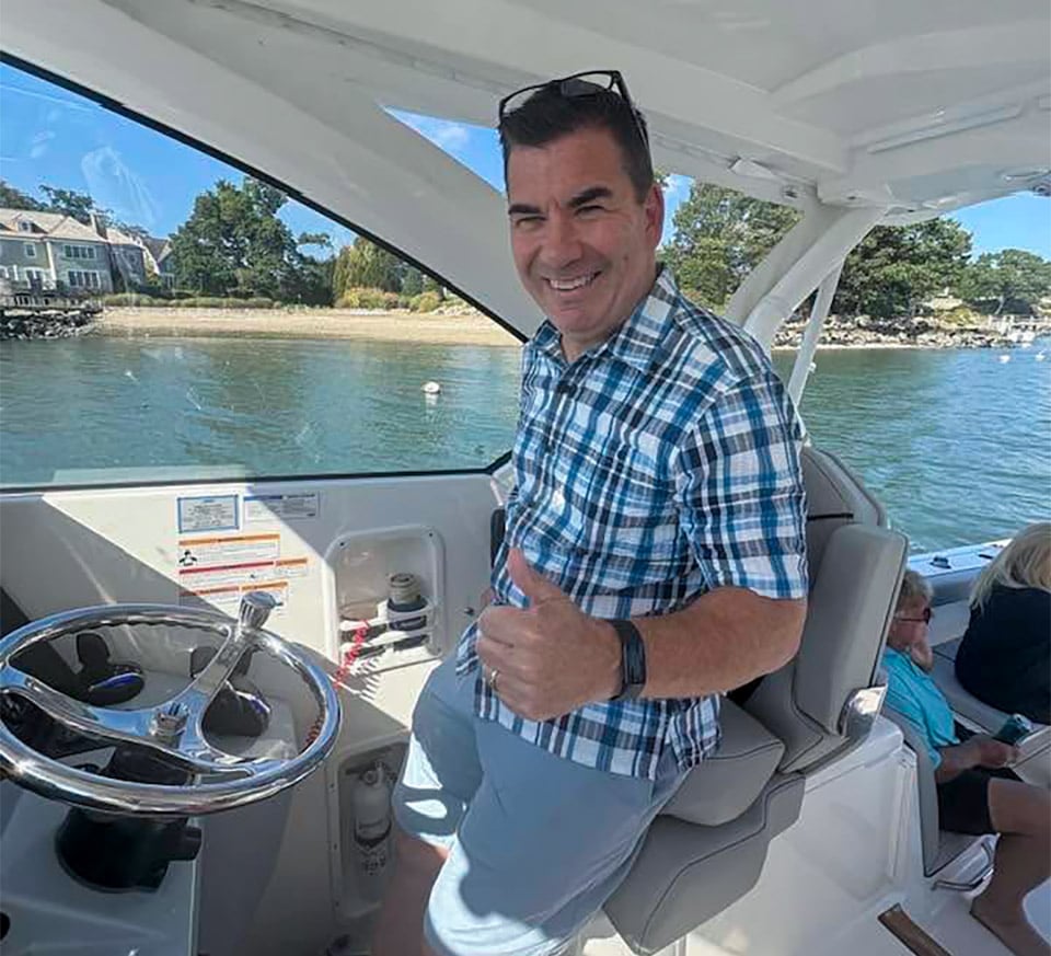 Mark Miller at the helm of his Pursuit OS 355 Offshore boat.