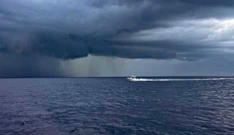 Milton & Debbie's DC 266 in the Bahamas in a storm