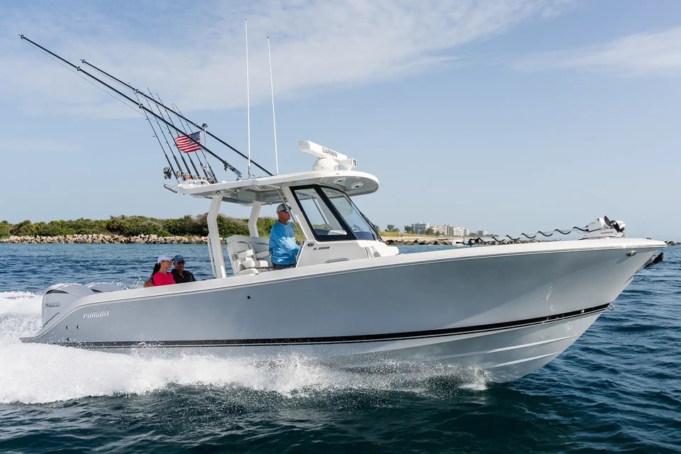 The all-new Pursuit S 288 center console underway with Garmin Force Kraken trolling motor and passengers aboard.