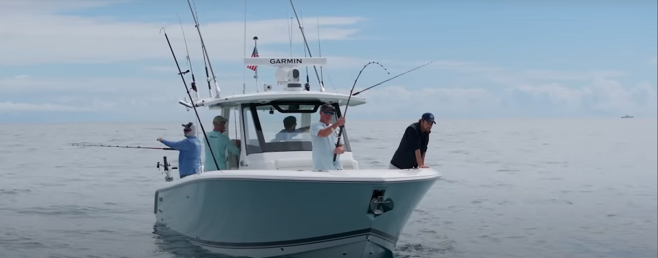 A crew fishes off the Pursuit S 328 Center Console boat