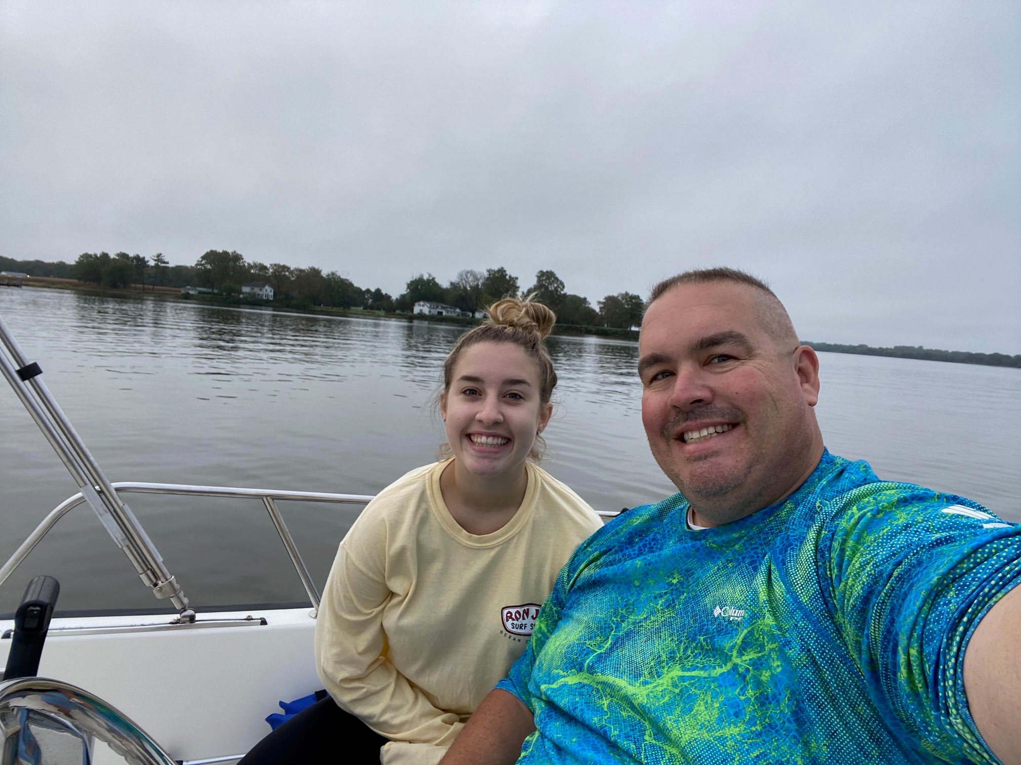 Captain Brett with family on his Pursuit OS 355