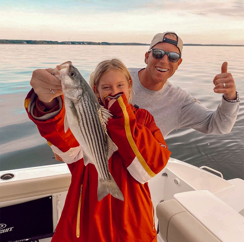 Father and daughter fishing on their Pursuit Boat