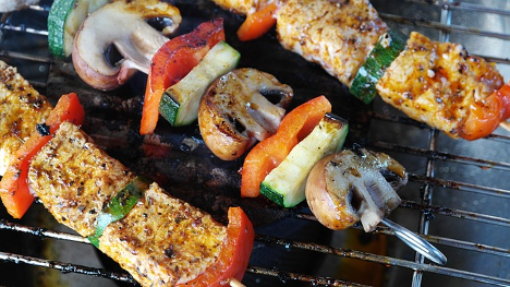 Kebabs cooking on a grill