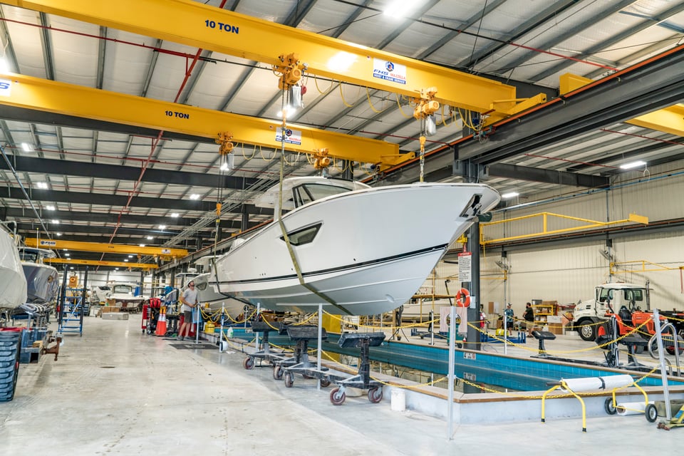 Pursuit boats moving forward down the production line.