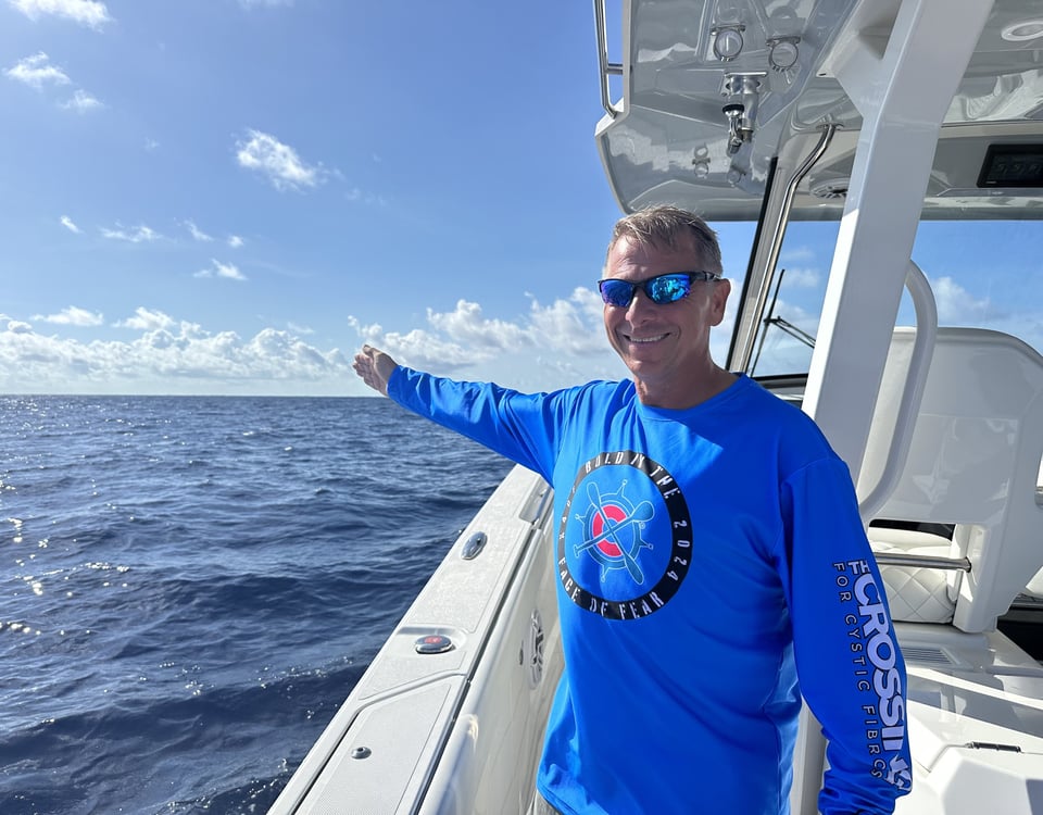 Mark King pointing to the Bahamas