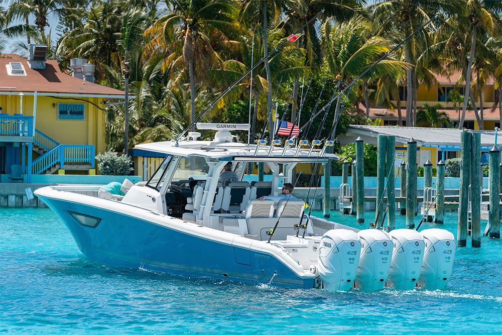 Pursuit Boats Sport S 428 Center Console Boat with quad Yamaha Engines cruises in the Bahamas.