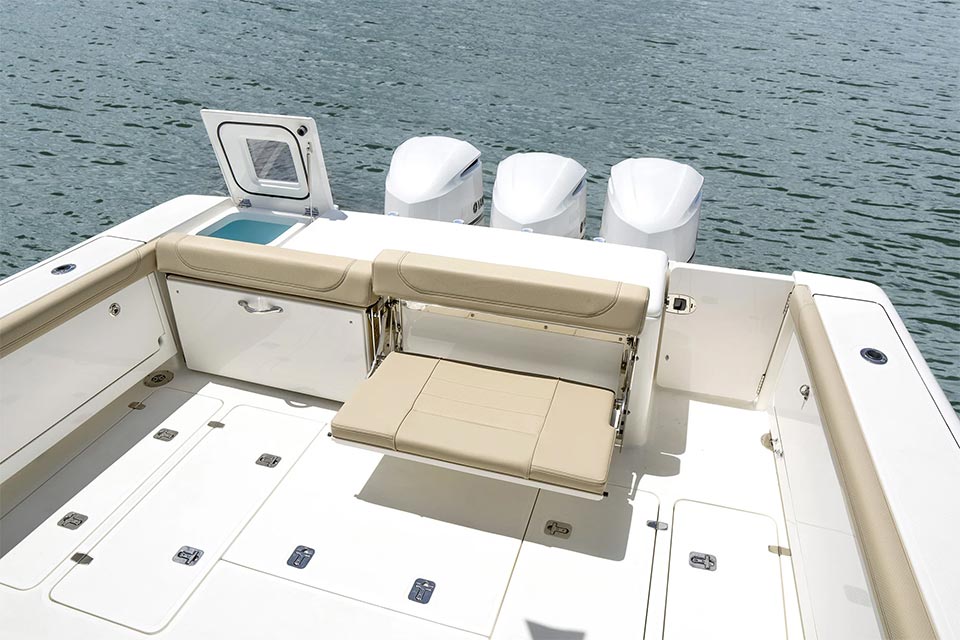OS 385 Offshore boat transom featuring livewell and fold down seating and fish boxes.