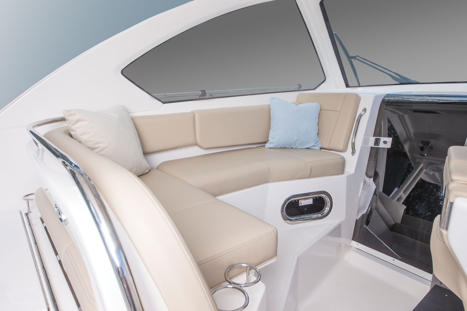 Comfort features abound on the Pursuit OS 325, such as this L-shaped seating to port.