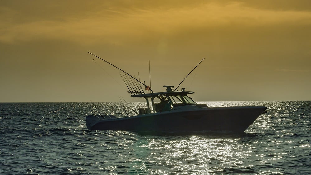 Profile of Pursuit S 428 at sunrise preparing for a great day of fishing.
