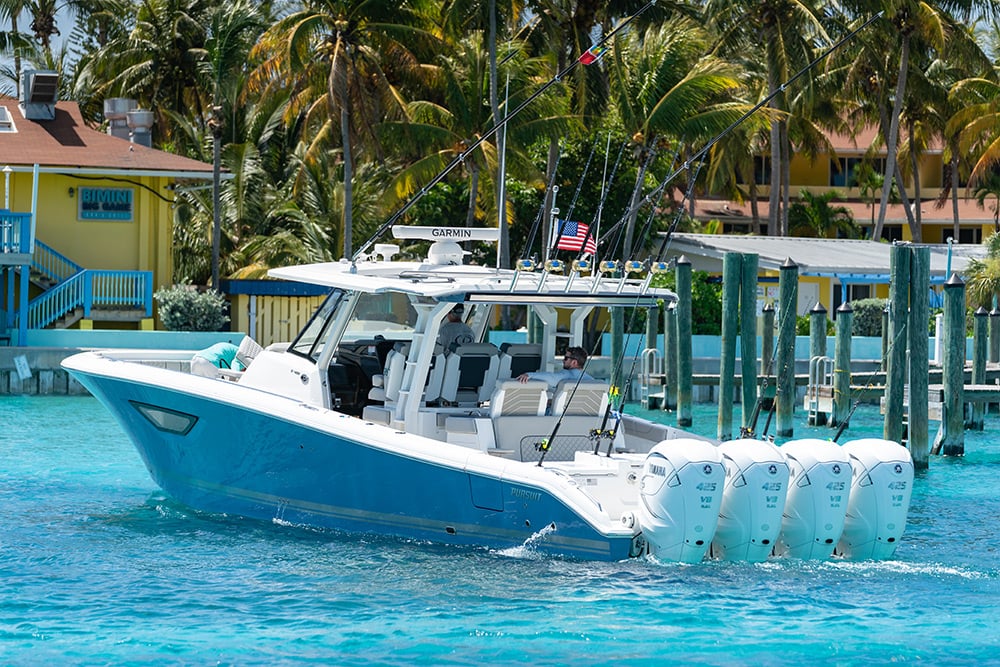 Pursuit Boats Sport S 428 Center Console Boat with quad Yamaha Engines cruises in the Bahamas.