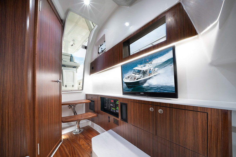 Interior photo of the Pursuit S 358 Sport Center Console boat with cabin for overnighting.