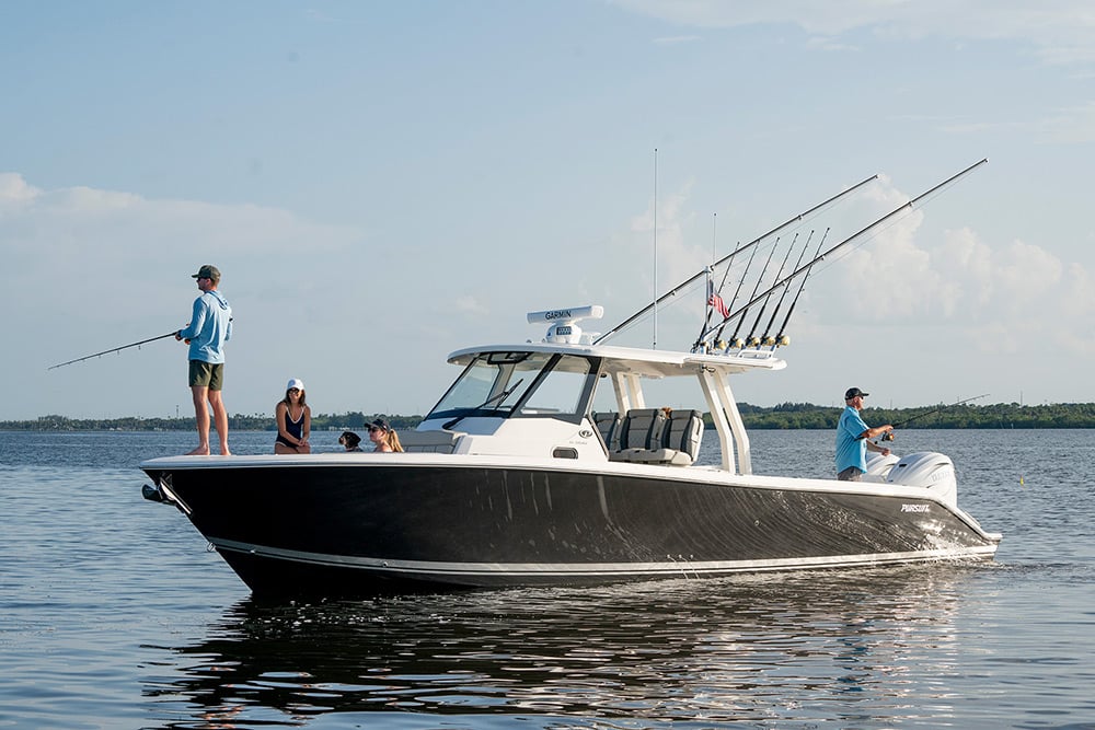 People fishing on the Pursuit Boat S 358 Sport Center Console fishing boat.