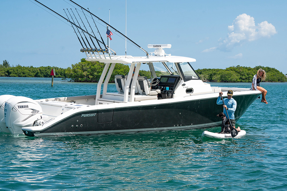 A family boat, the image shows Pursuit Boats S 358 Center Console boat with people enjoying the boating lifestyle.